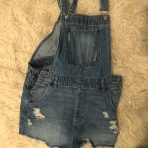 ripped jean overalls